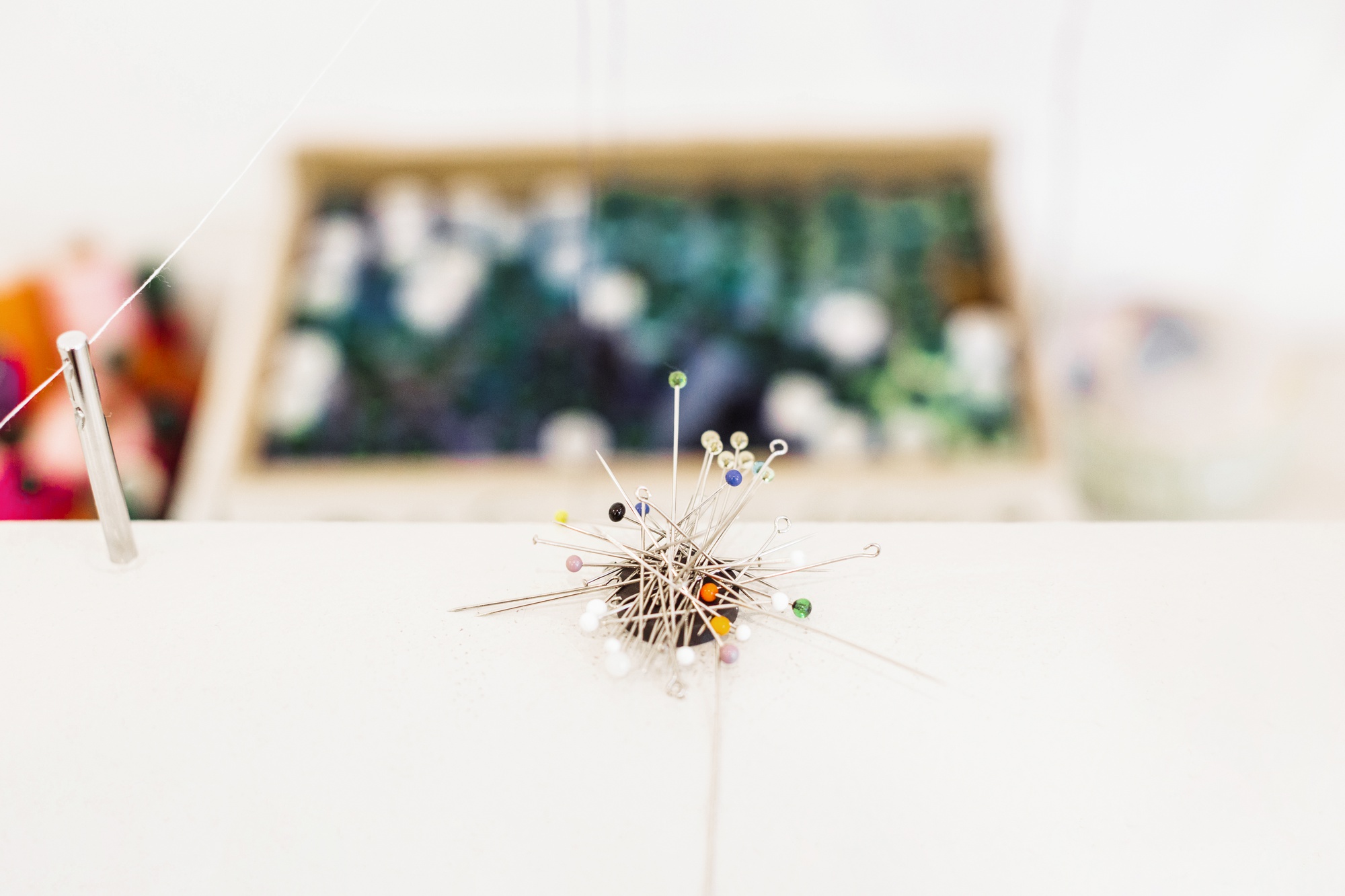 open workshop table with natural light and needles