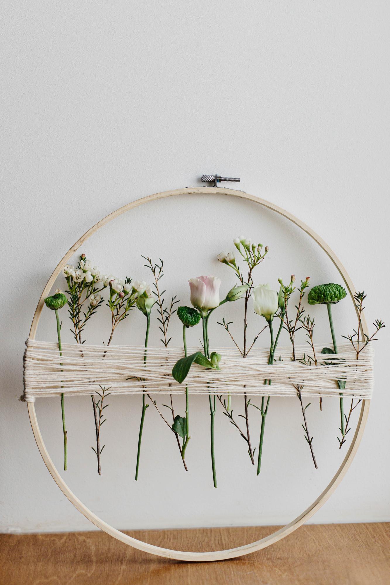 Close-up of pastel embroidery hoop with floral motif