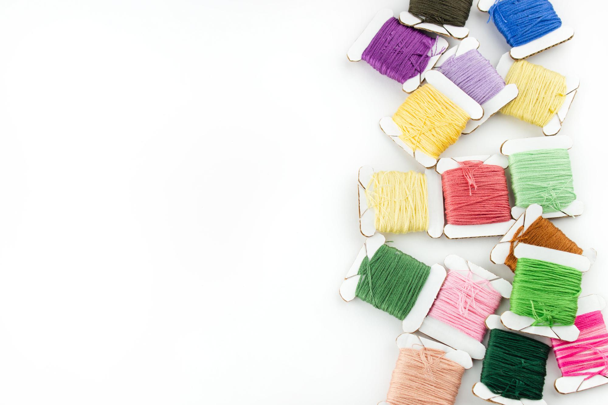 flatlay of stitched patches and threads